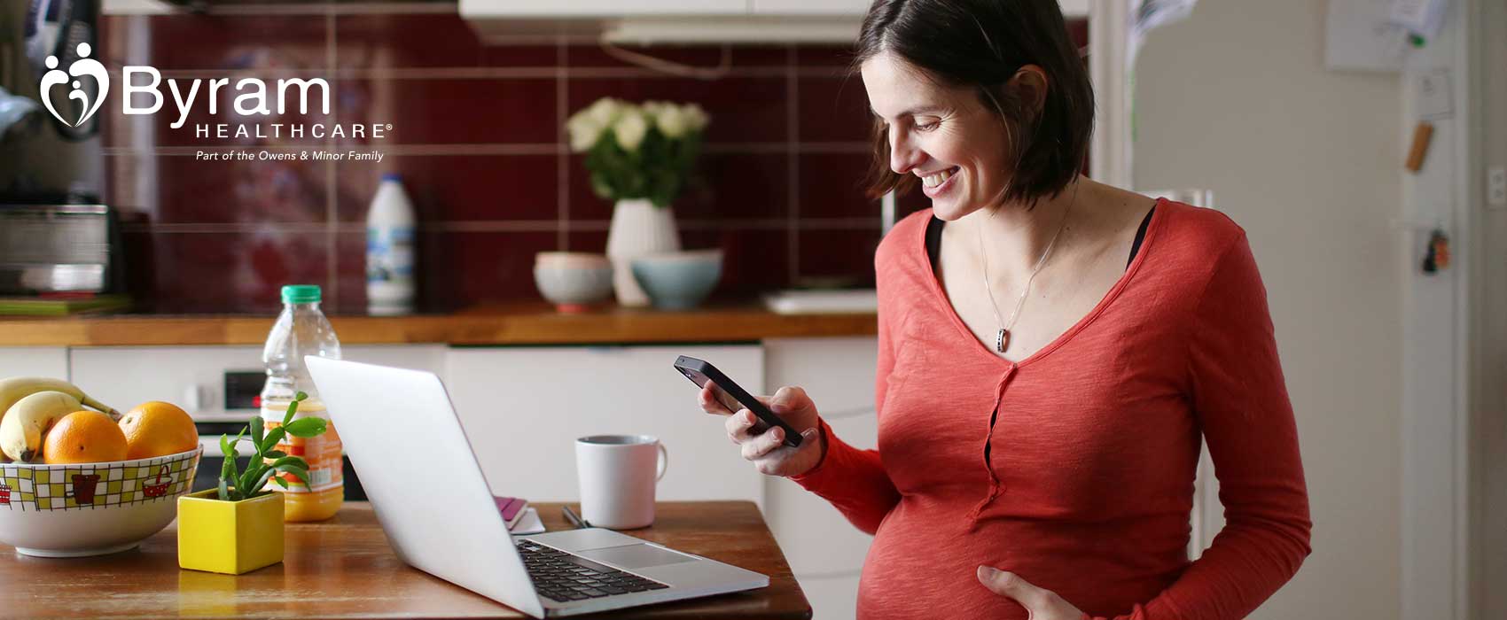 Pregnant woman looking at her phone.